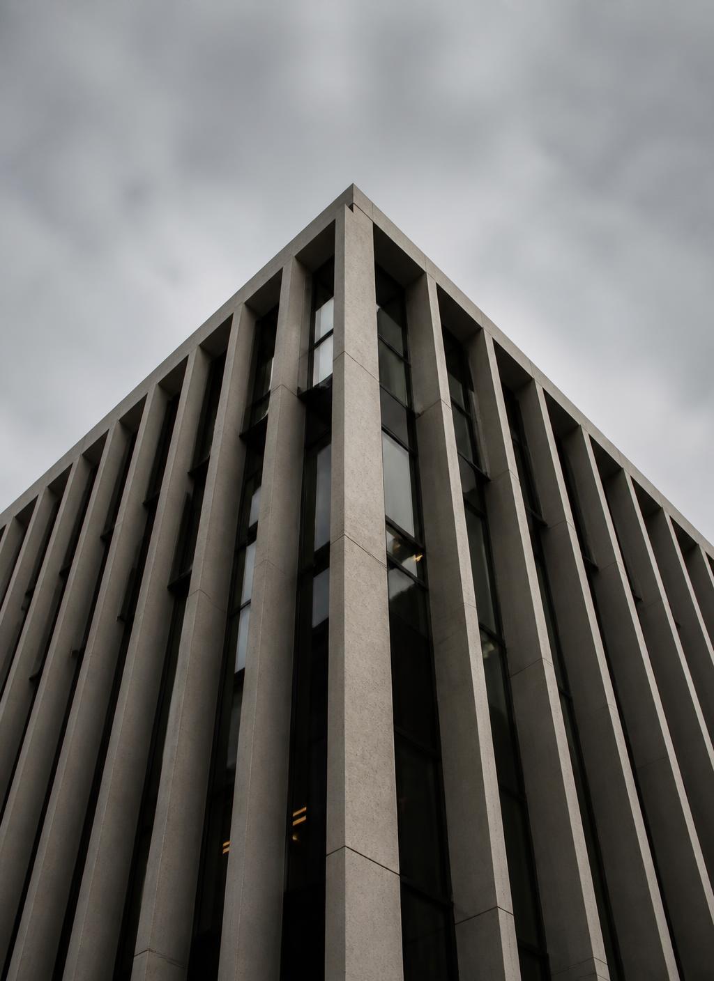 Corporate office building facade in Johannesburg with vertical concrete fins and dark glazing